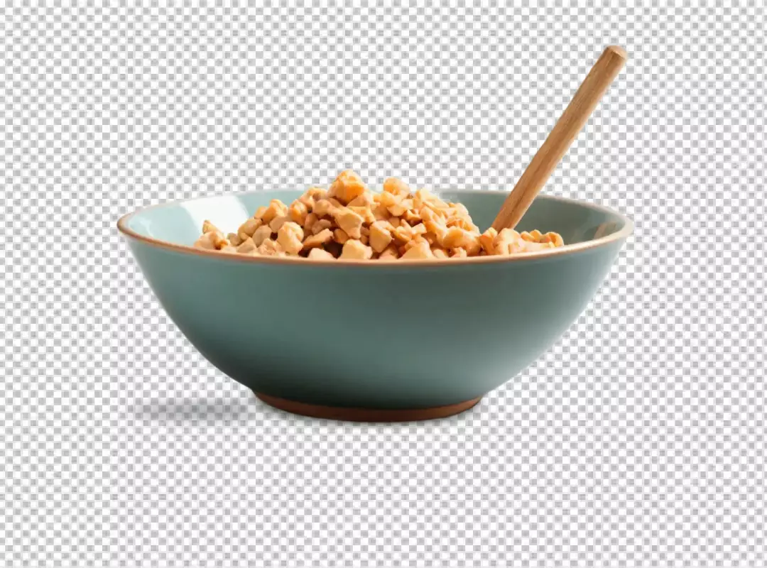 Finely Chopped Nuts in a Vibrant Teal Bowl with a Small Wooden Spoon