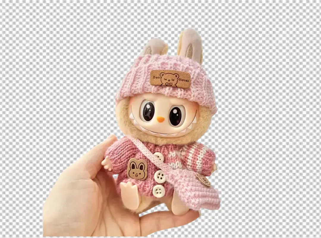 Adorable Pink Knitted Monster Plush Toy with Bunny Hat Held in Hand