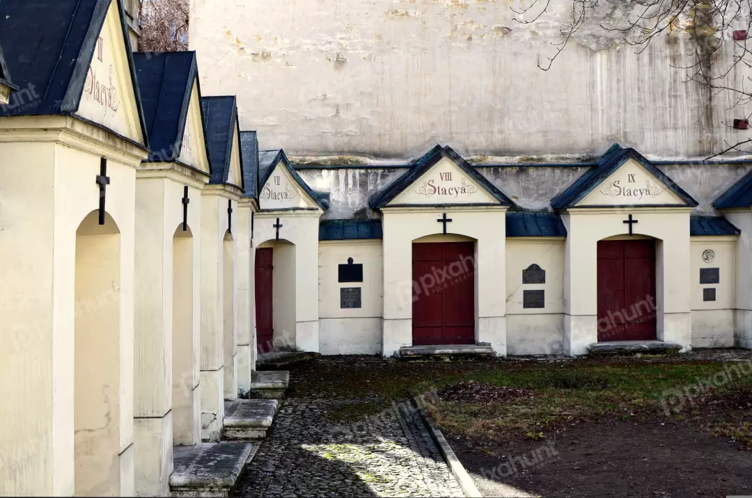 Historic Stations of the Cross Chapels Along Cobbled Path in European Monastery