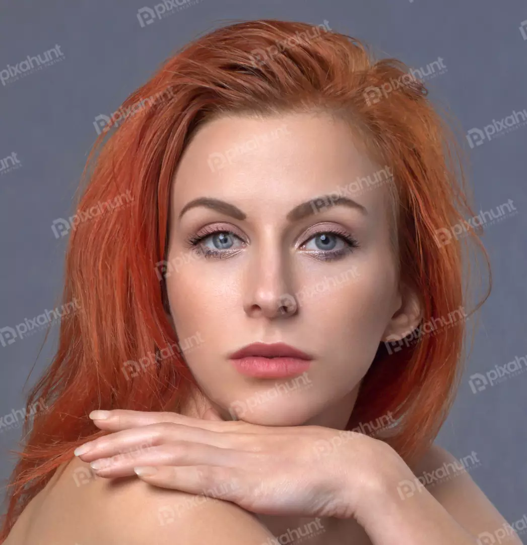 Close-up Portrait of Redhead Woman with Blue Eyes and Serene Expression
