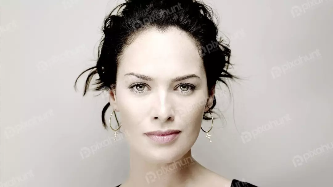 Compelling Portrait of a Woman with Piercing Grey-Green Eyes and Dark Hair