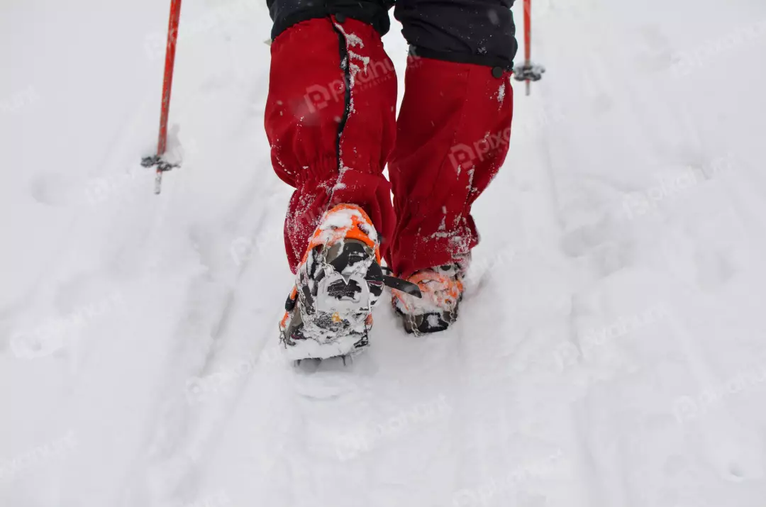 Winter Snow Trekking with Crampons and Ski Poles
