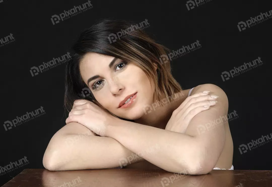 Thoughtful Young Woman with Short Hair and Crossed Arms Portrait