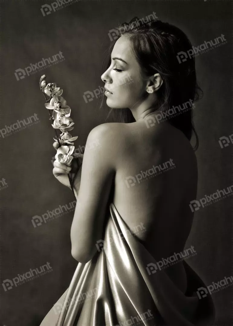 Monochrome Portrait of Woman with Closed Eyes and Orchids in Gentle Drape