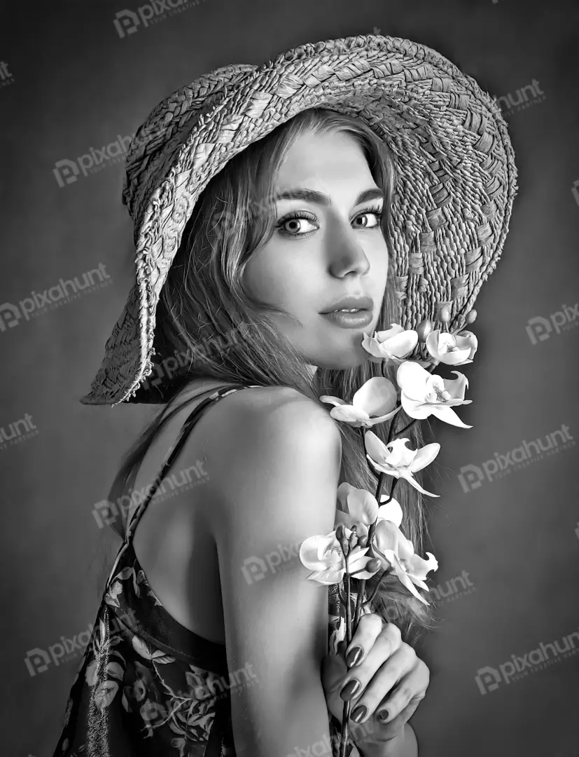 Elegant Young Woman in Straw Hat with Orchids Black and White Portrait