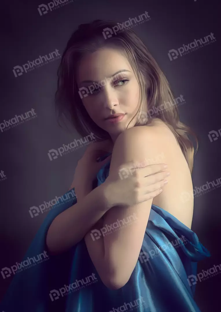 Pensive Young Woman Draped in Blue Satin Cloth with Elegant Expression