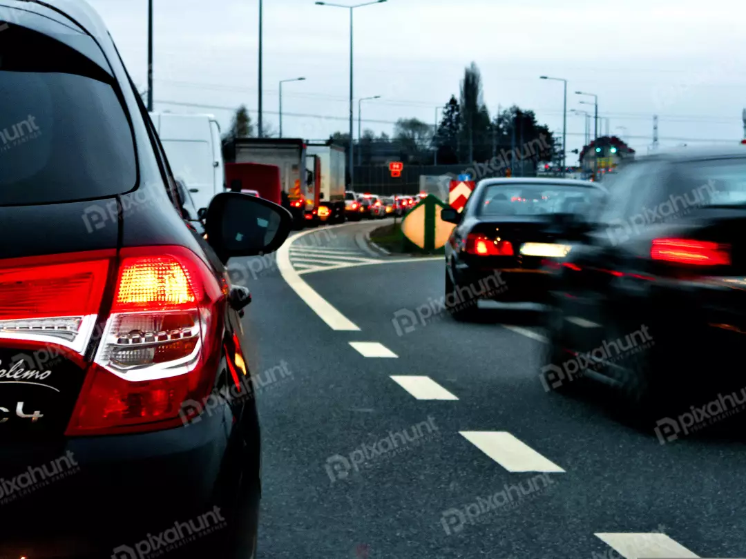 Urban Traffic Jam at Dusk with Vehicle Taillights and Motion Blur on a Busy Highway