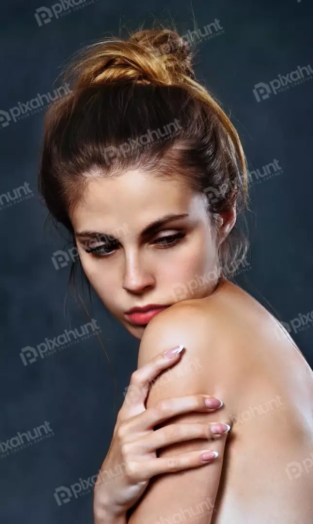 Thoughtful Young Woman with Elegant French Manicure Posing Serene