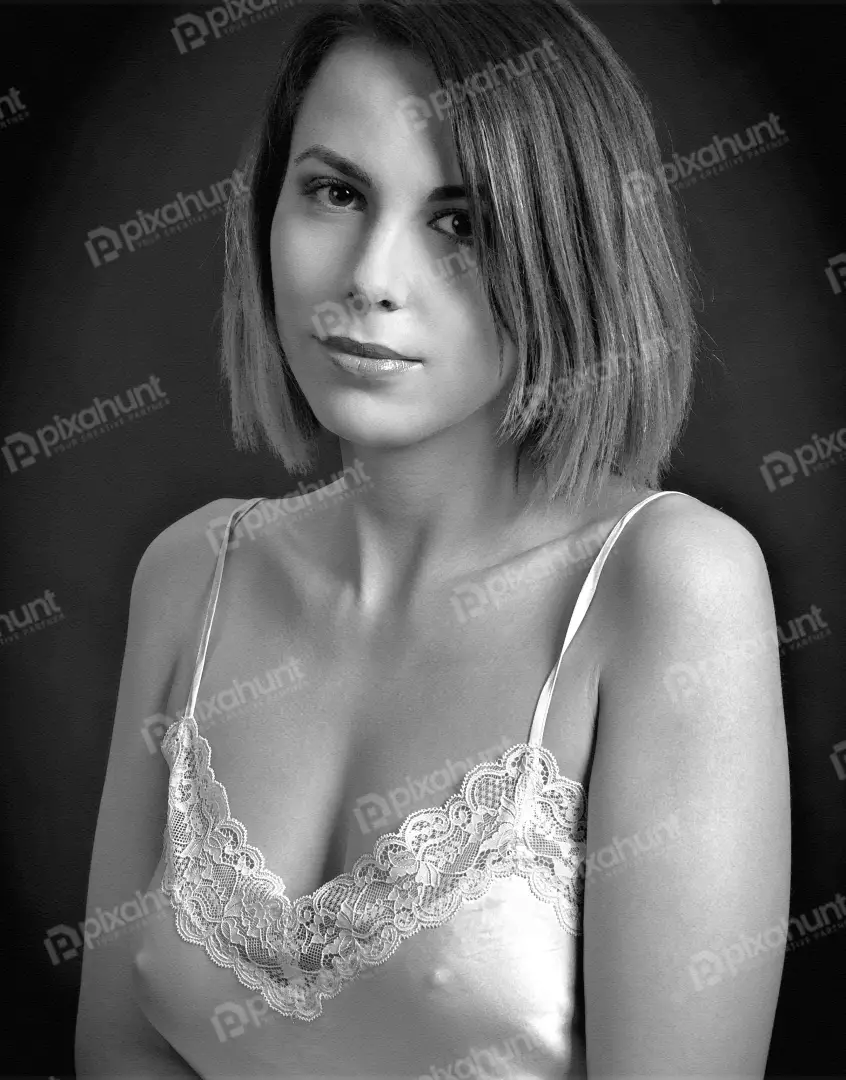 Monochrome Portrait of Young Woman in Lace Top with Serene Gaze