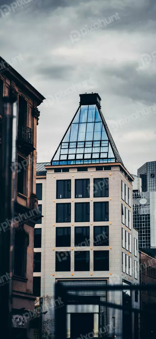 Free Premium Stock Photos Modern architecture with glass pyramid roof against cloudy sky