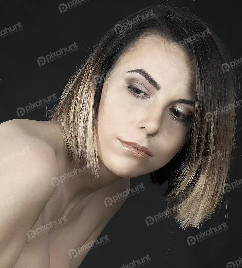 Pensive Young Woman with Stylish Ombre Bob Hair and Bare Shoulders