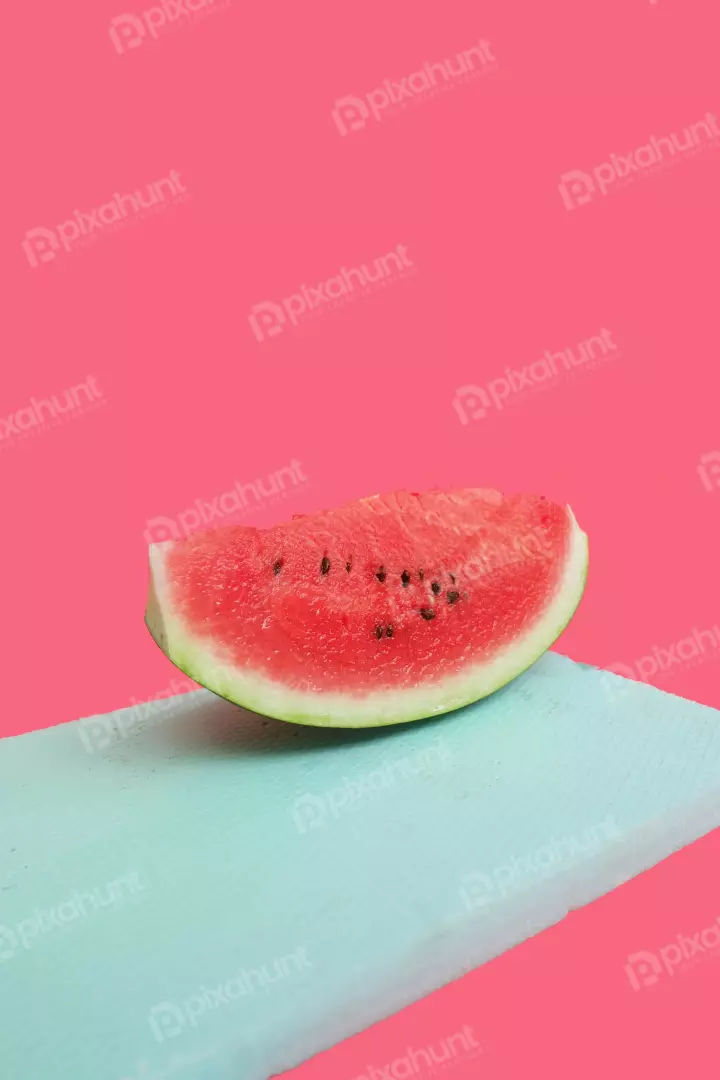 Free Premium Stock Photos Refreshing Watermelon Slice on Textured Teal Surface Against Pink Background