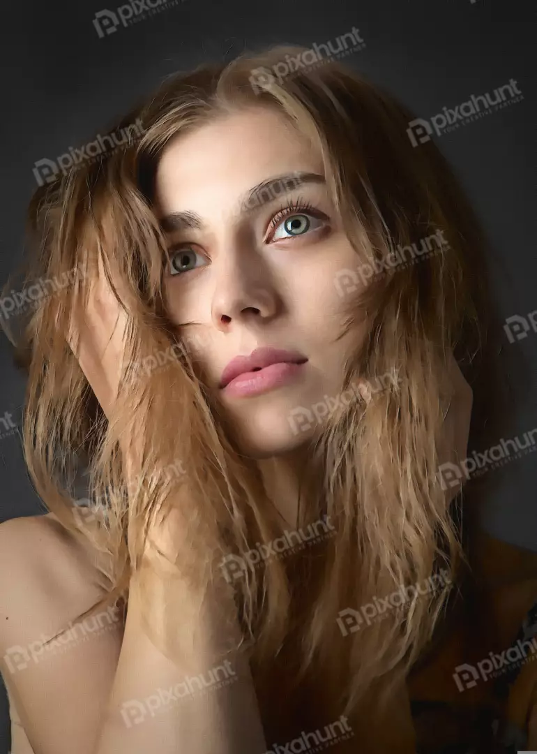 Thoughtful Portrait of a Beautiful Young Woman with Flowing Blonde Hair