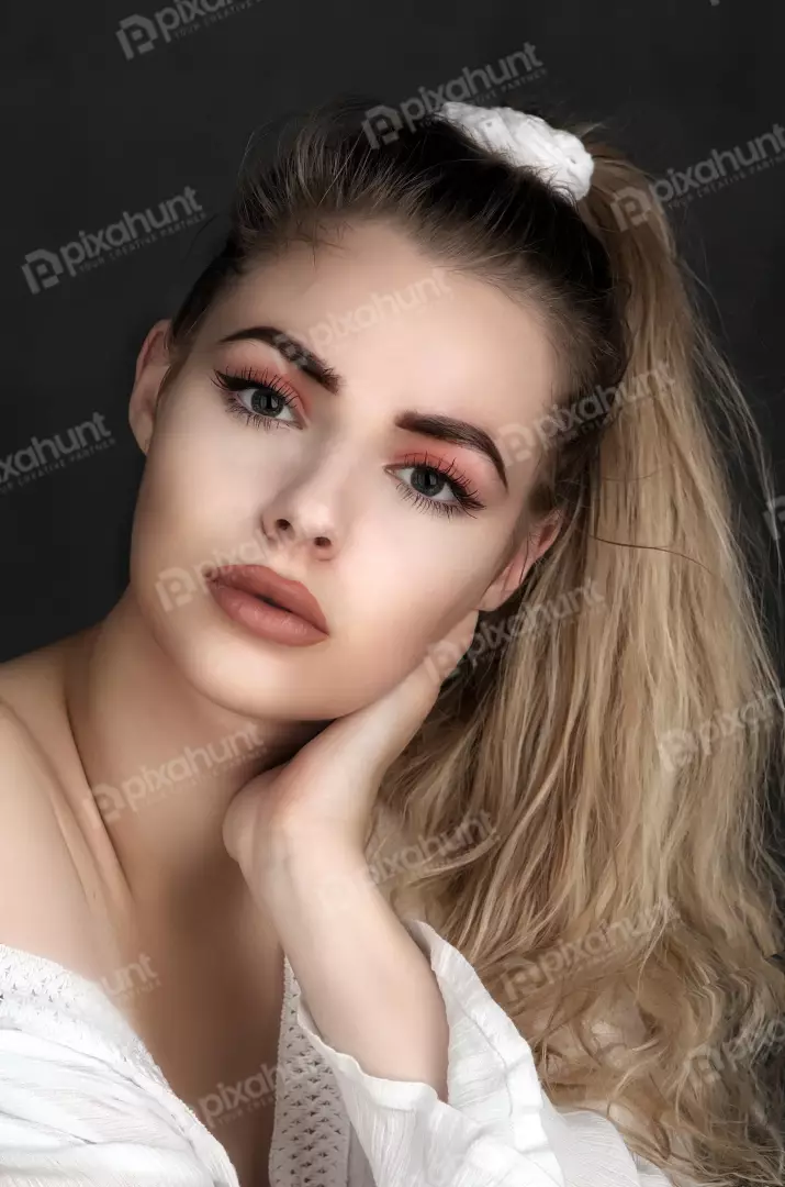Elegant Woman with Wavy Blonde Hair and Expressive Gaze