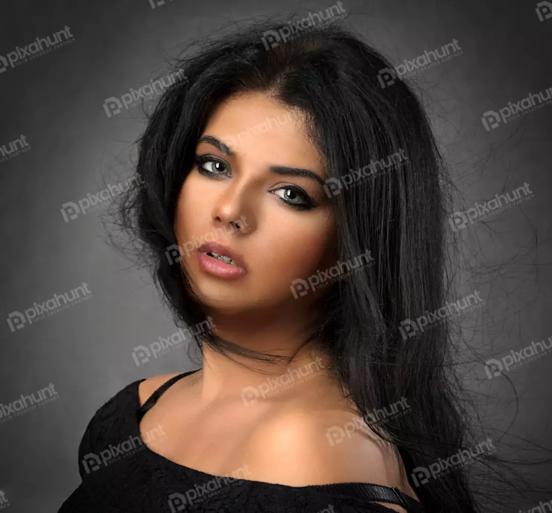Mesmerizing Close-up Portrait: Young Woman with Dark Hair and Striking Light Eyes