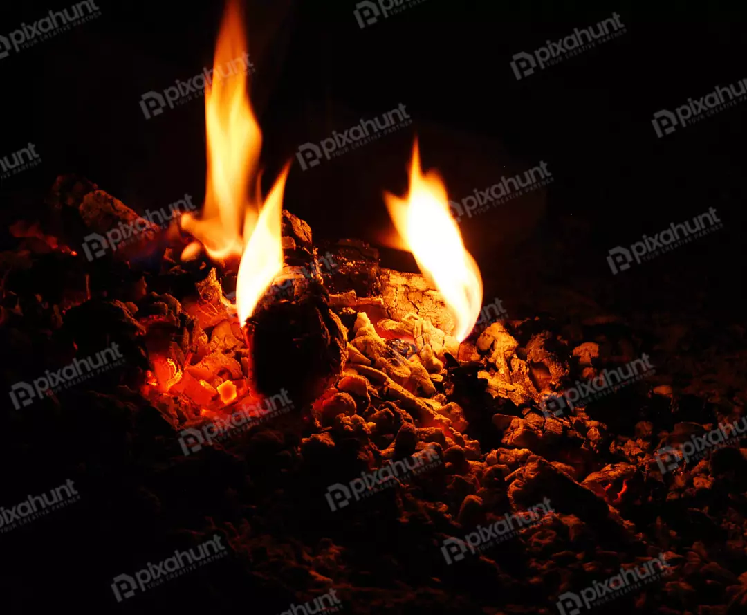 Vibrant Glowing Embers and Flames Illuminating a Dark Background with Intense Heat