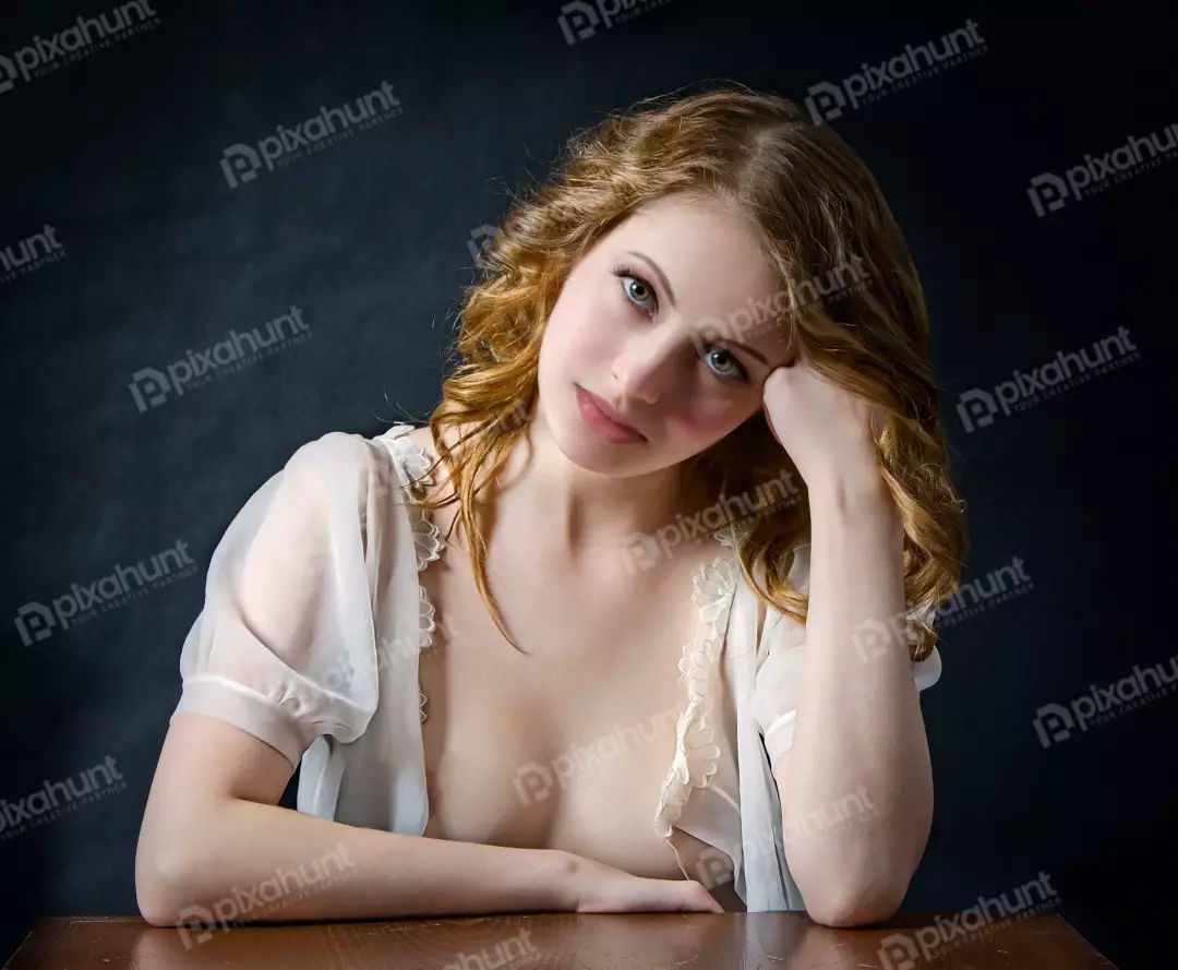 Pensive Young Woman with Green Eyes in Sheer White Lace Top