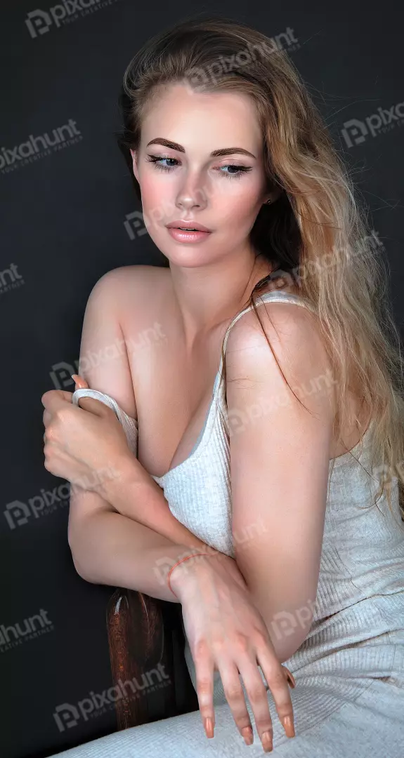 Beautiful Young Woman Sitting Thoughtfully Elegant Pose Studio Light Stock Photo