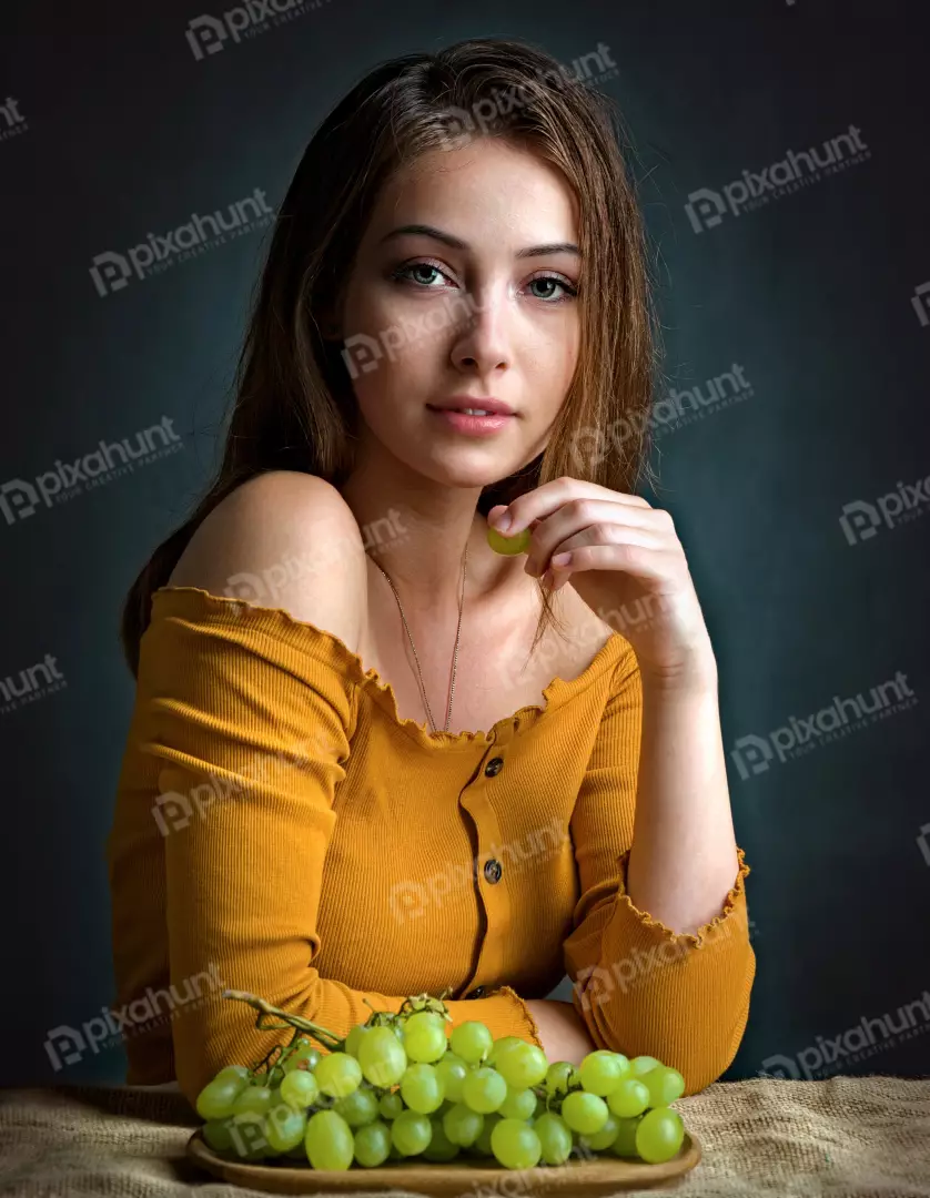 Young Woman Posing with Fresh Green Grapes for Healthy Lifestyle