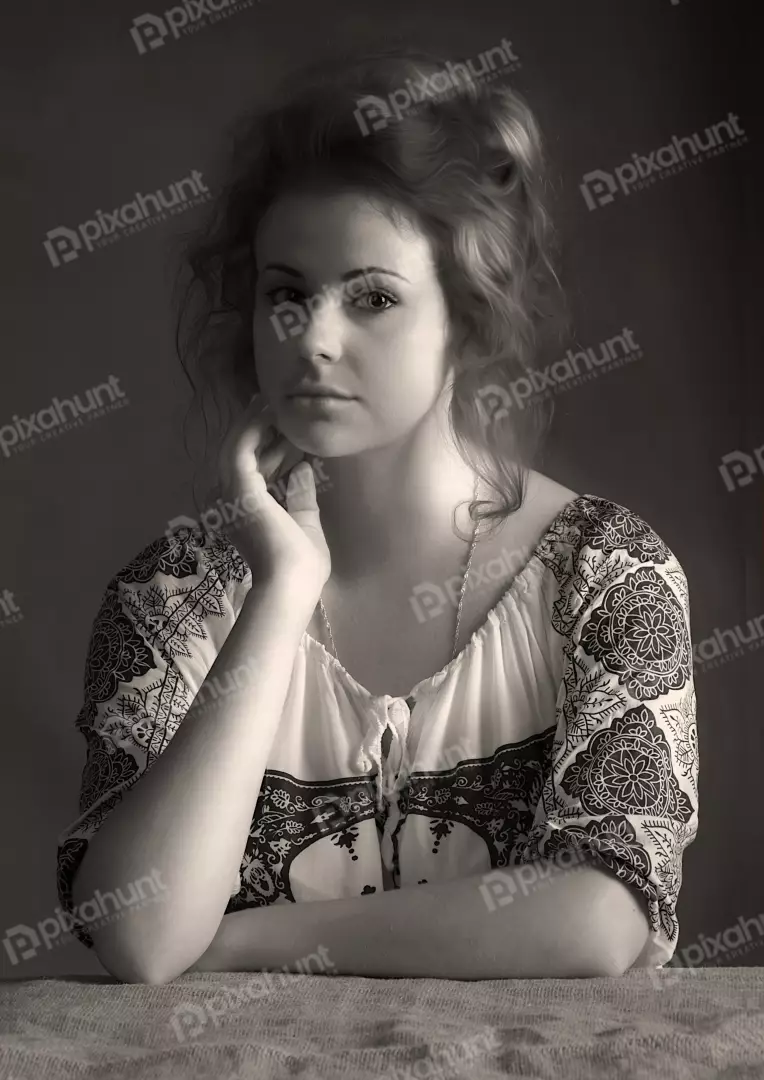 Pensive Young Woman in Traditional Blouse, Sepia Portrait with Thoughtful Gaze