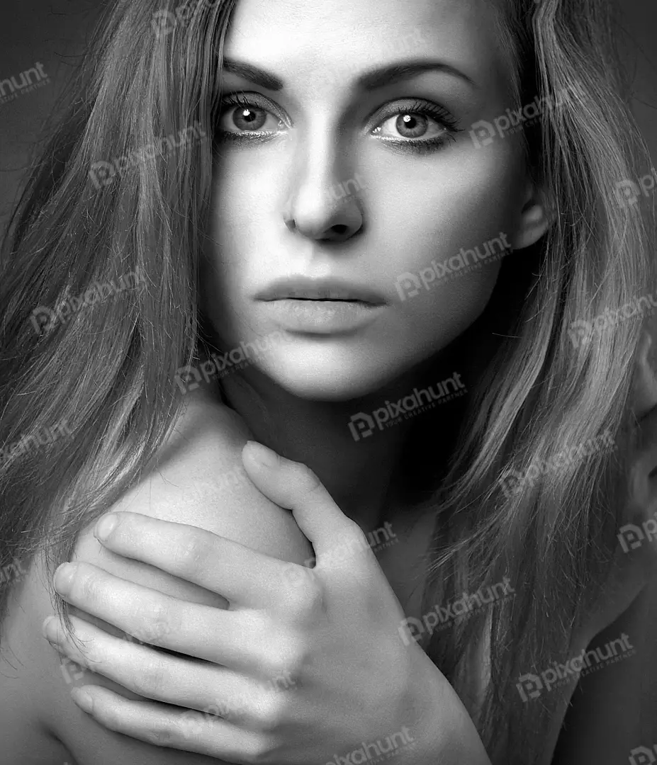 Captivating Black and White Portrait of a Pensive Young Woman with Dramatic Lighting