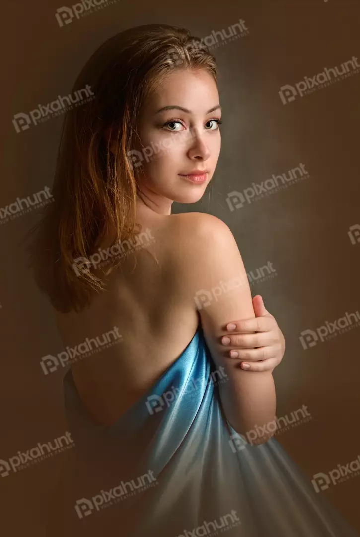 Captivating Young Woman in Blue Drape and Bare Shoulders
