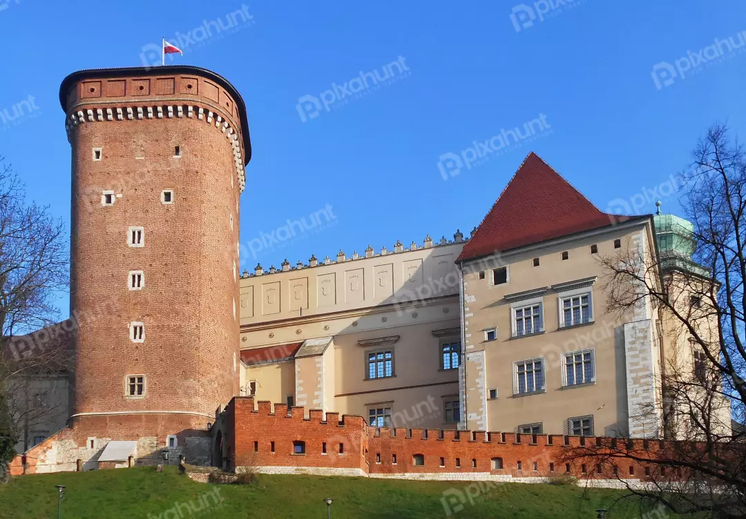 Majestic Wawel Royal Castle historic architecture under clear blue sky in Krakow