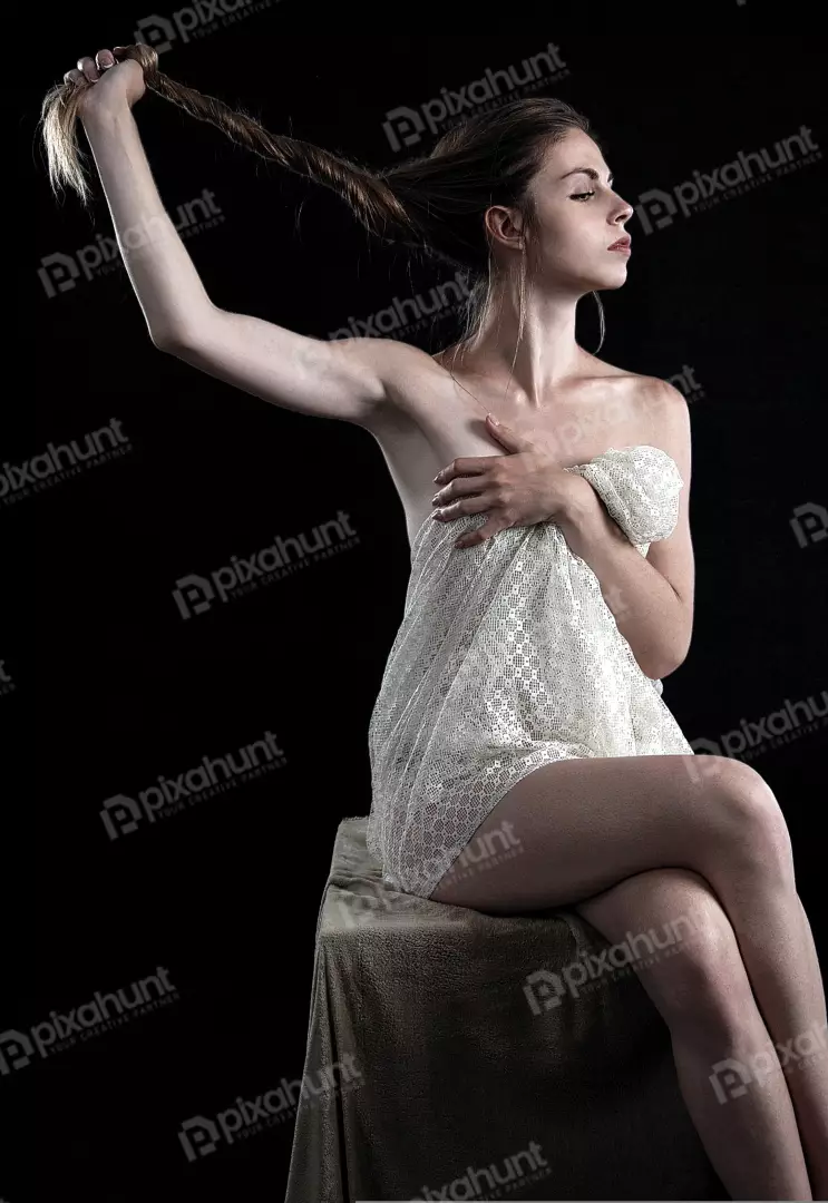 Serene Young Woman with Braided Hair and Delicate Lace Fabric