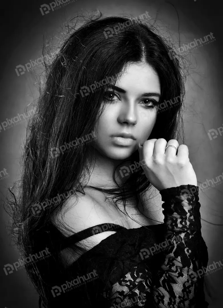 Dramatic Monochrome Portrait of a Pensive Woman with Long Hair and Elegant Lace