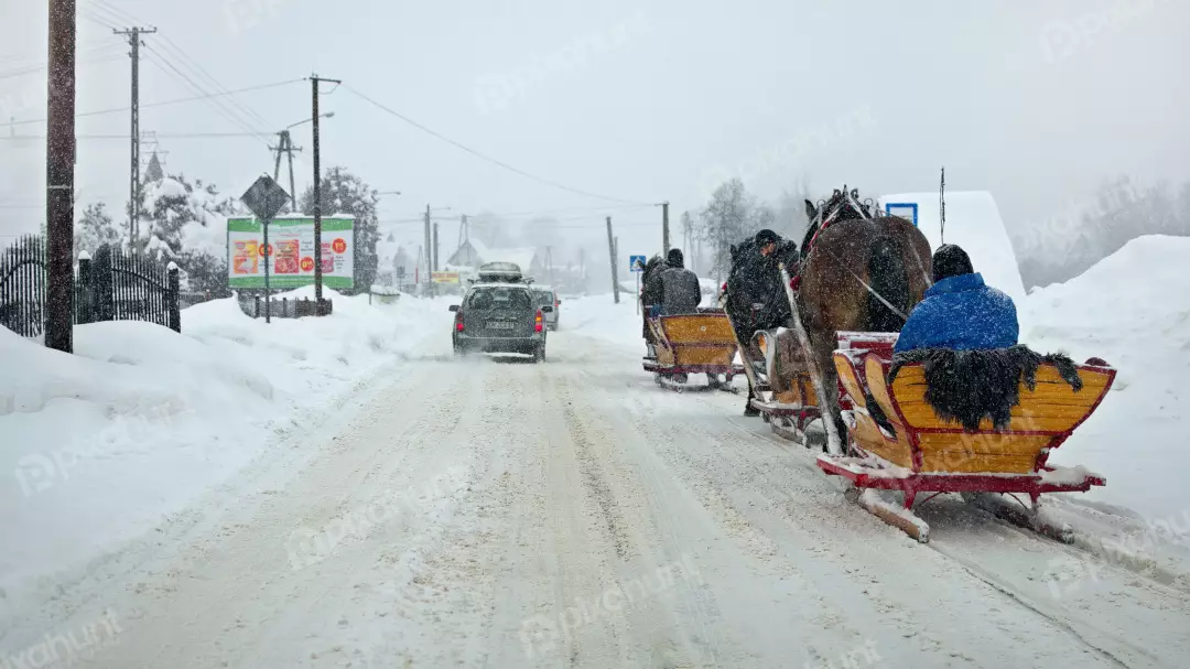 Winter Kulig: Horse-Drawn Sleighs and Car on Snowy Rural Road