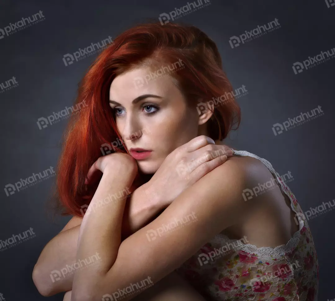 Contemplative Red-Haired Woman in Pensive Pose with Floral Lace