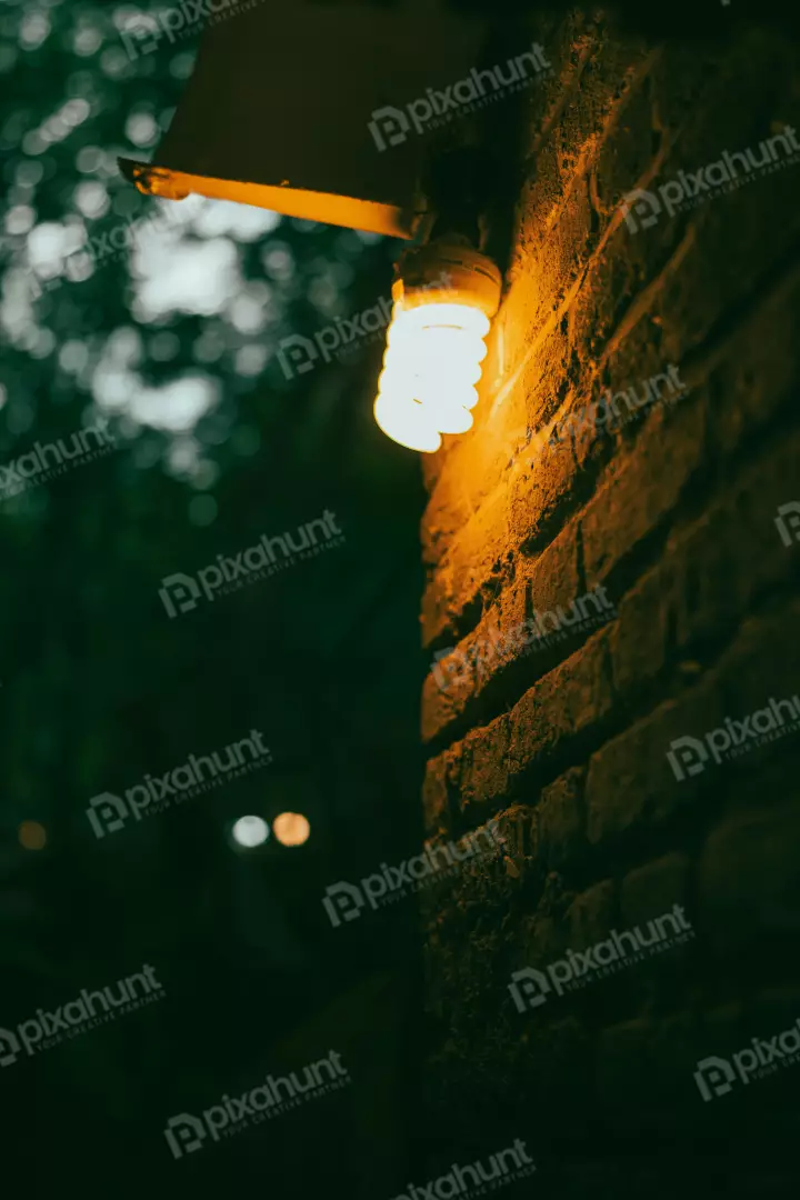 Free Premium Stock Photos Spiral Bulb Warm Glow Old Brick Wall