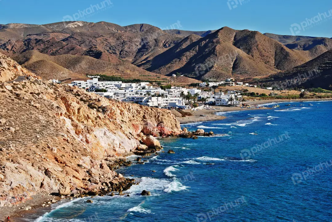Picturesque Coastal Village Nestled by Rocky Cliffs and Vibrant Blue Mediterranean Sea