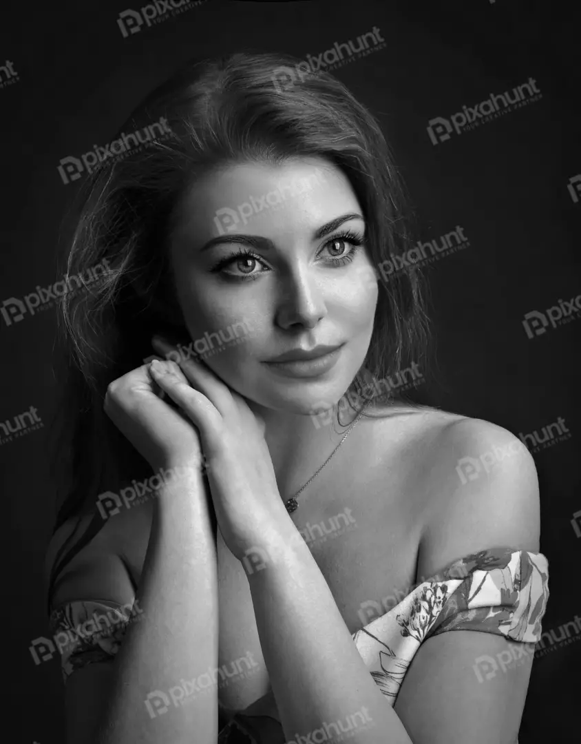 Elegant Black and White Portrait with Clasped Hands and Serene Expression
