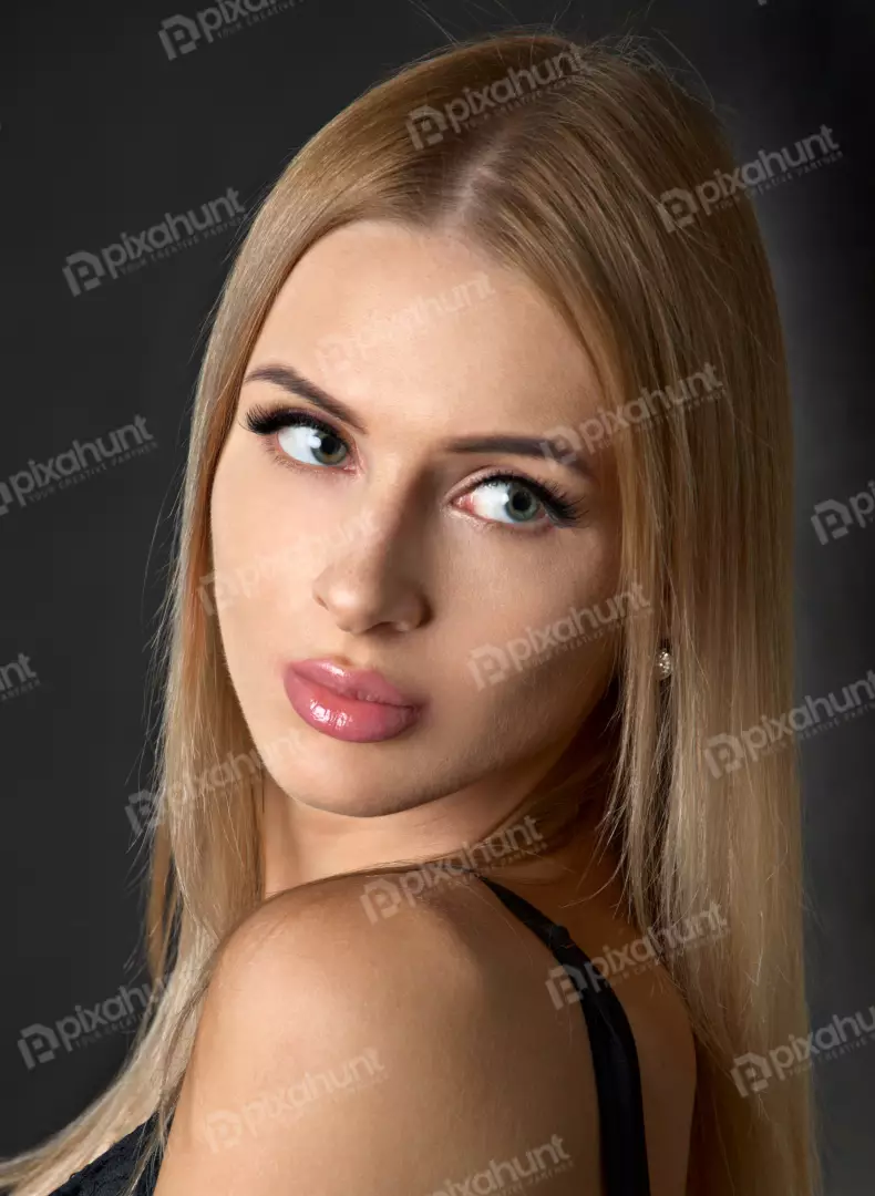 Captivating Blonde Woman with Green Eyes and Glossy Pink Lips