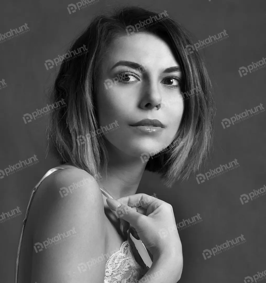 Classic black and white portrait of a young woman with pensive gaze