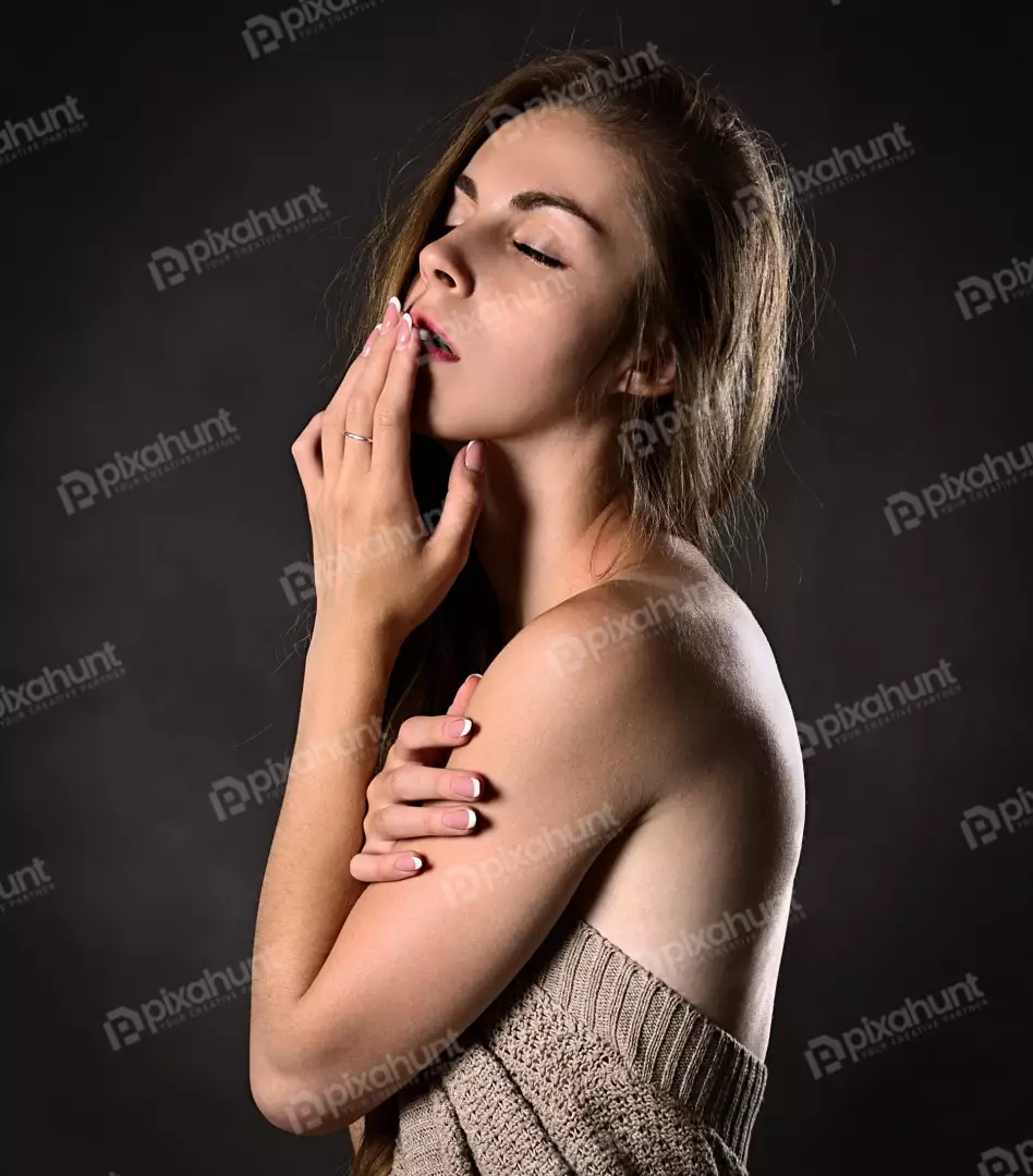 Elegant Woman's Sensual Portrait with Closed Eyes and Delicate Hands