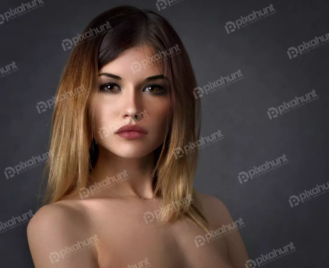 Expressive Young Woman with Ombre Hair and Piercing Gaze Portrait
