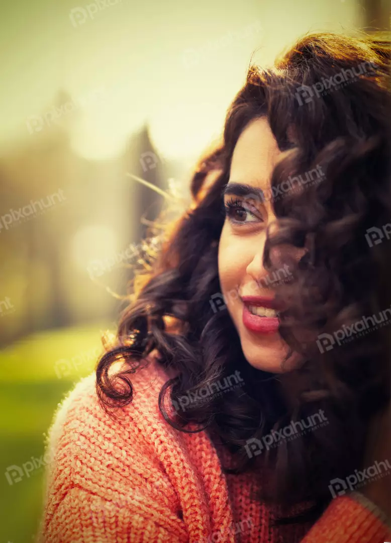 Free Premium Stock Photos Smiling Woman with Curly Hair in Golden Hour Sunlight