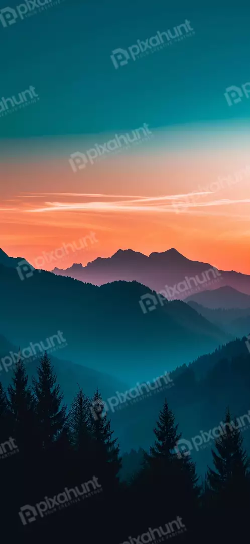 Free Premium Stock Photos Misty Mountain Range at Dusk with Fiery Sunset Sky
