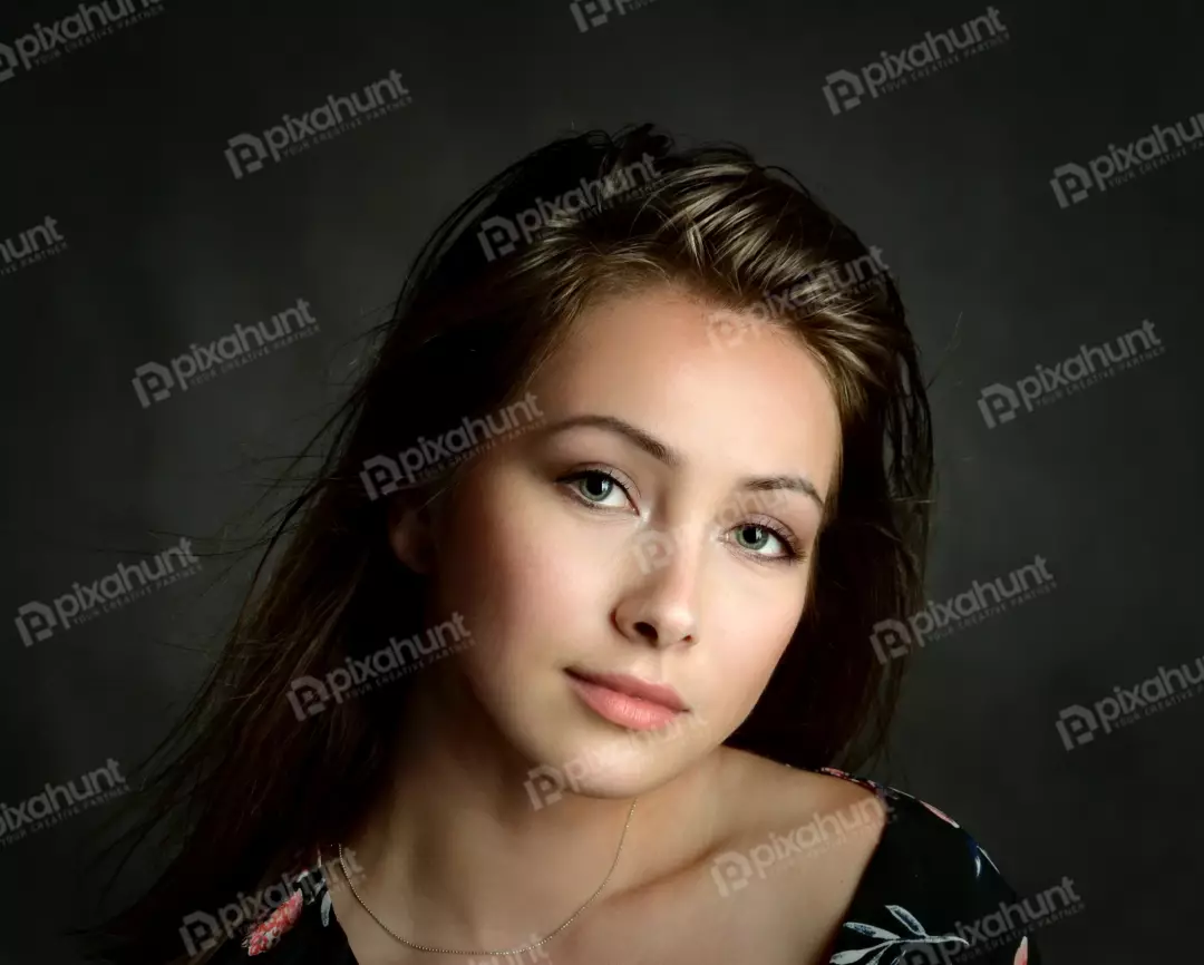 Captivating Young Woman with Light Green Eyes and Flowing Hair