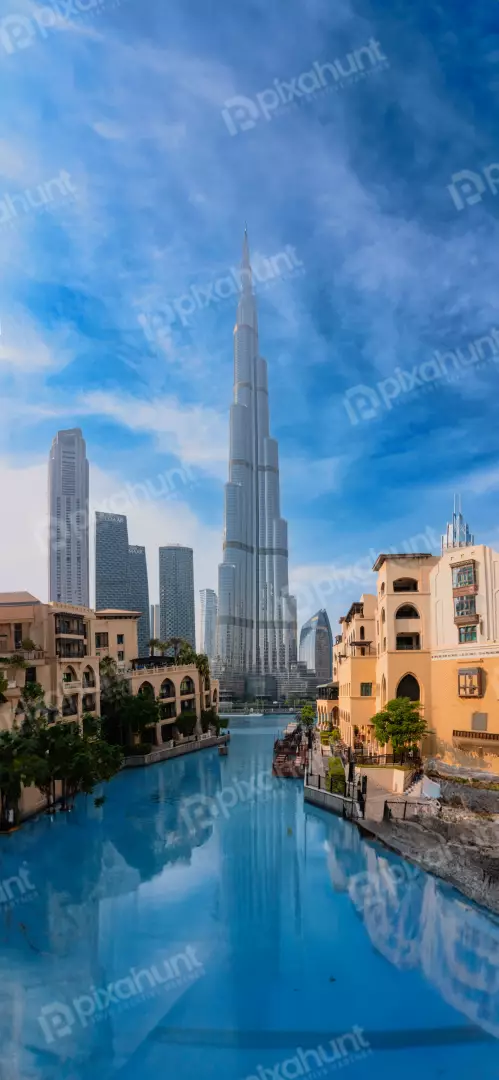 Free Premium Stock Photos Iconic Dubai Skyline with Burj Khalifa and Canal on a Sunny Day