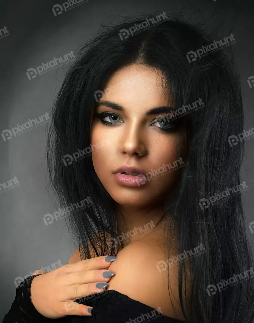 Intense Beauty Portrait of Woman with Dark Hair and Smoky Eyes
