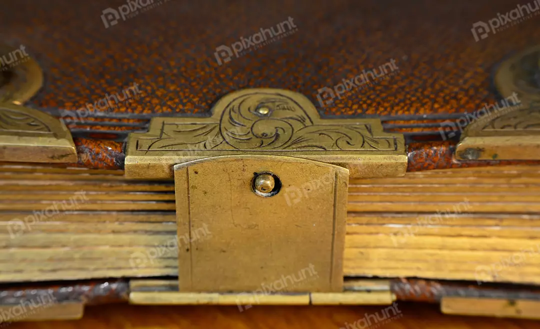 Ornate Antique Leather Book with Decorative Brass Clasp and Aged Pages