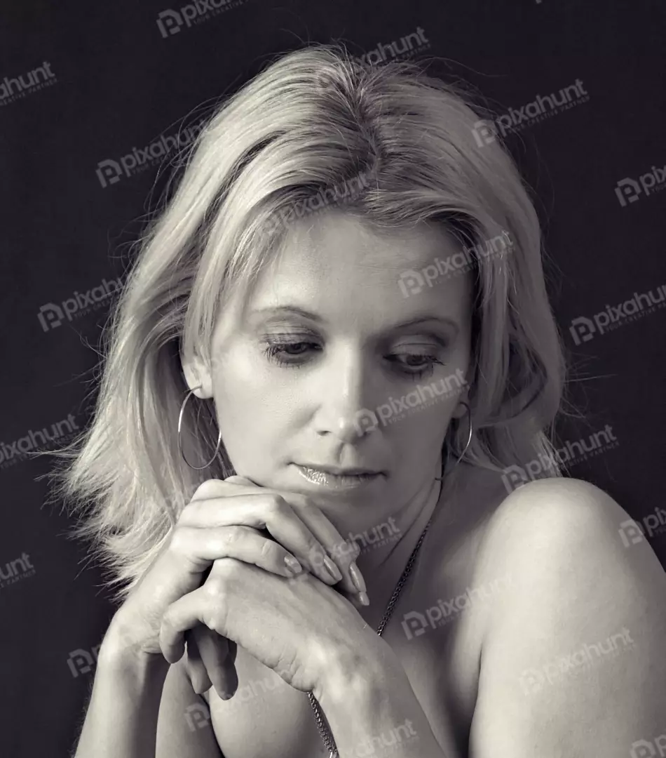 Elegant Blonde Woman in Pensive Monochrome Portrait