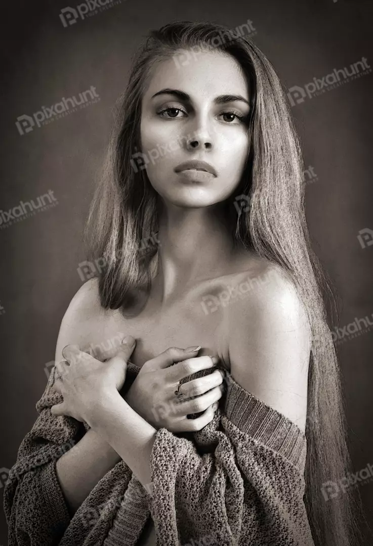 Elegant Sepia Tone Portrait of a Young Woman with Contemplative Gaze
