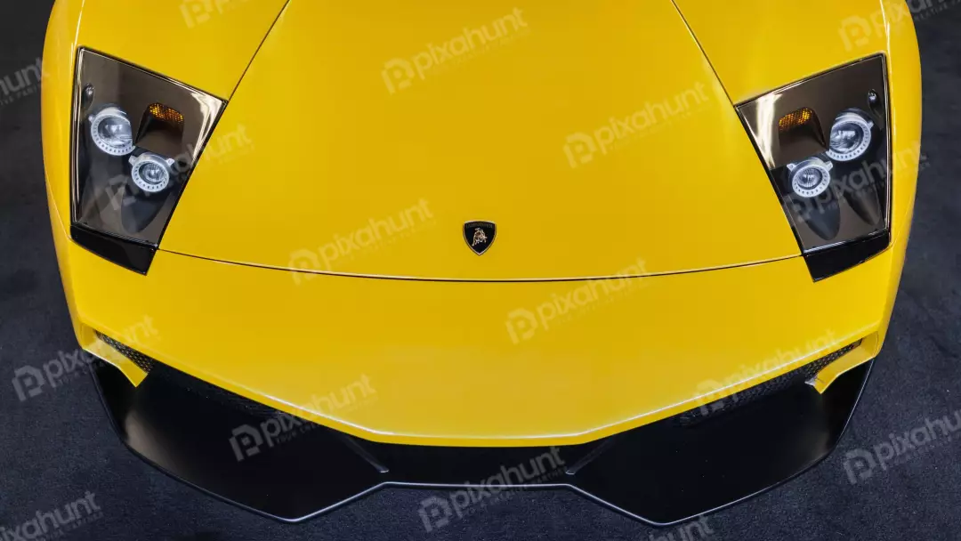Sleek Yellow Lamborghini Murcielago Supercar Front View with Headlights and Logo