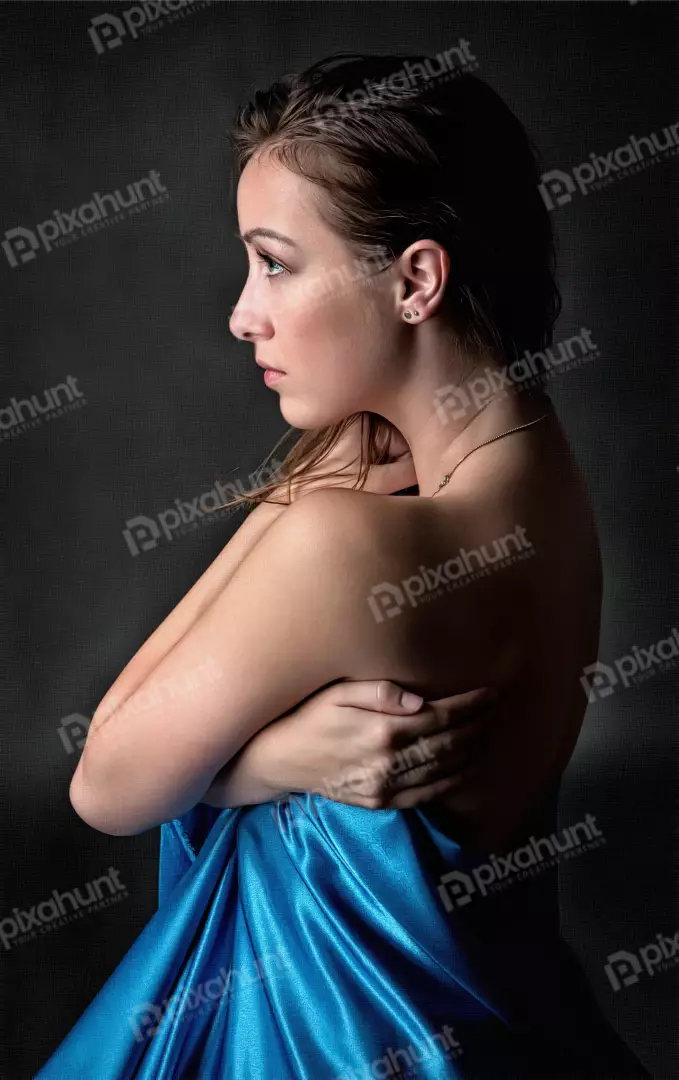 Serene Woman Draped in Blue Silk Fabric, Elegance Portrait