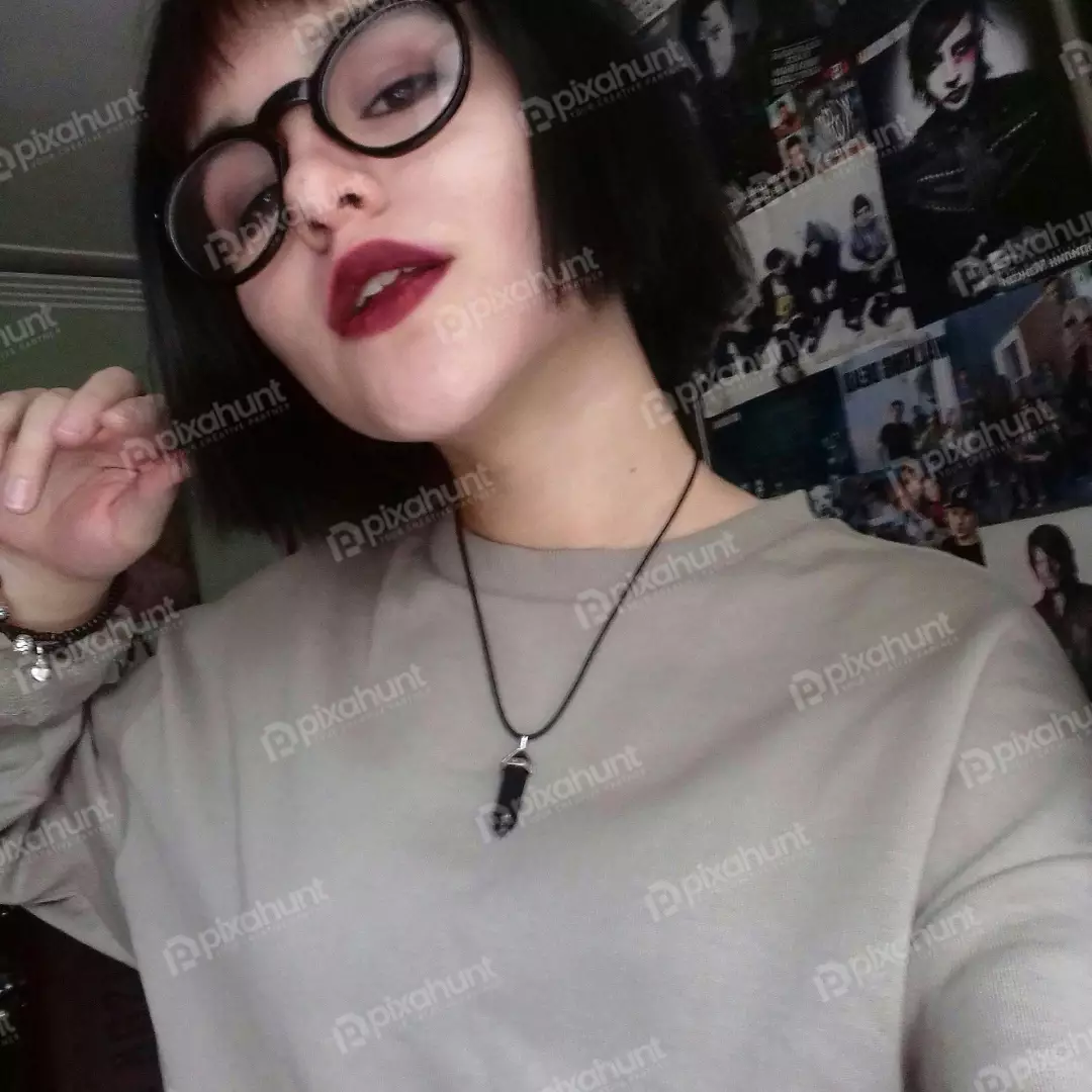 Free Premium Stock Photos Young woman with glasses and dark lipstick poses for a photo