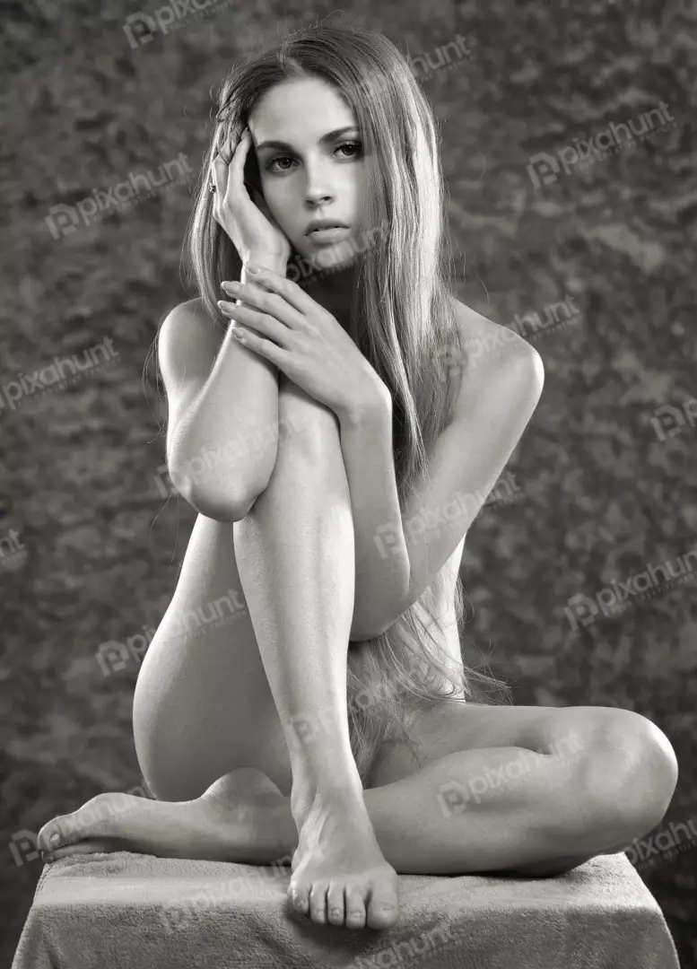 Striking Black and White Artistic Nude Portrait of a Pensive Young Woman